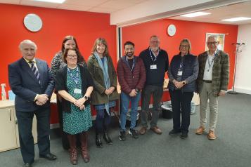 David Croisdale-Appleby, Chair of Healthwatch England (furthest left) meets with our staff and volunteers, and our Chair, Stewart Francis (furthest right).