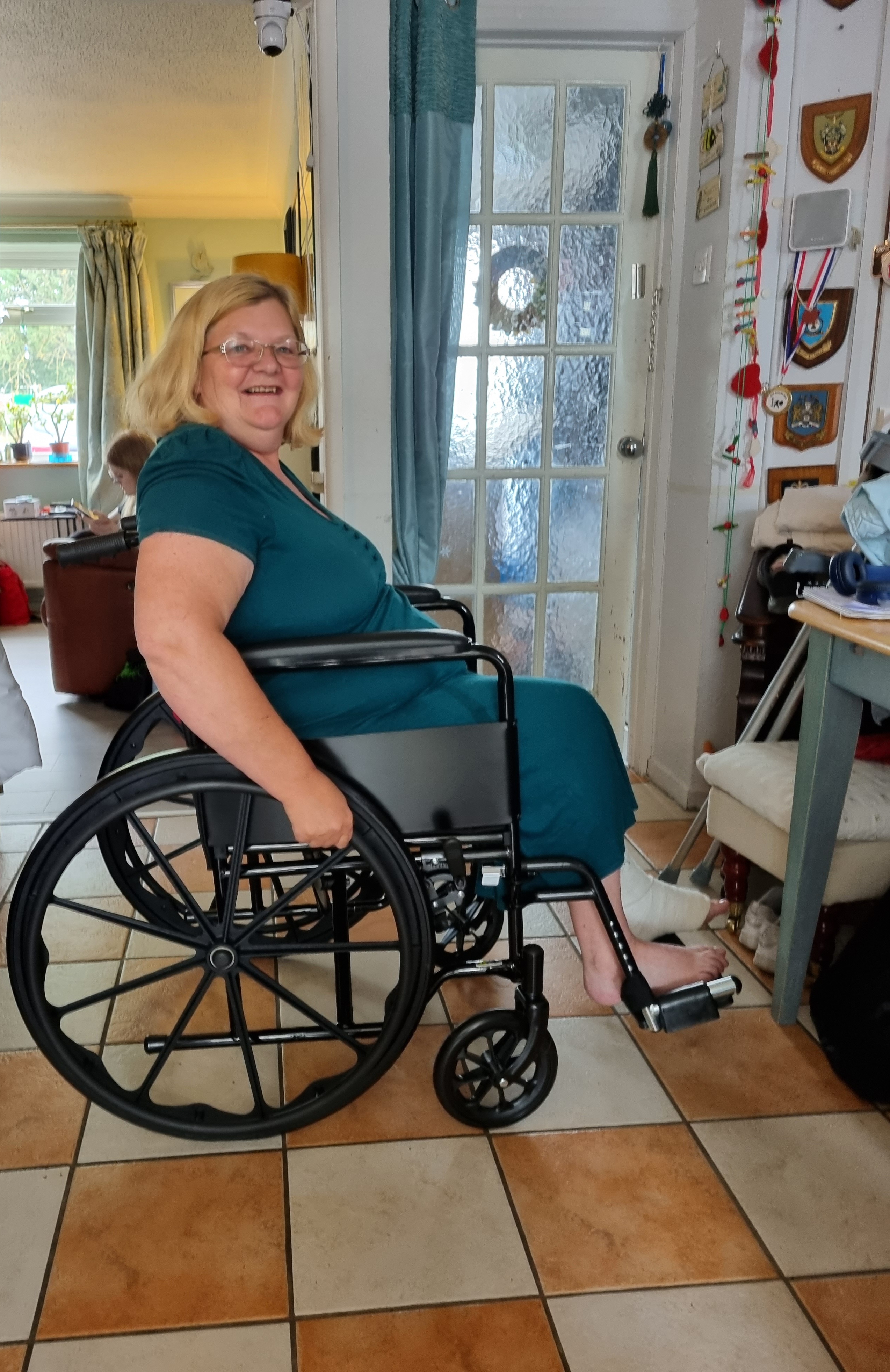 Paula using her wheelchair at home following her accident.