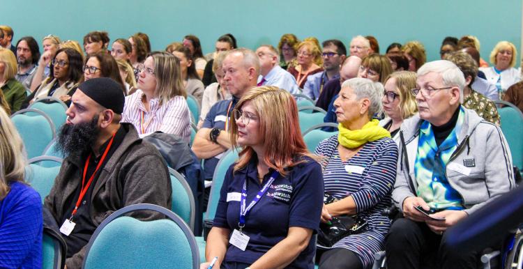 Audience listening to a presentation at Healthwatch Summit in October 2023