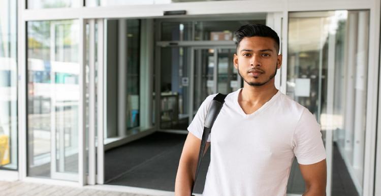 young man outside hospital