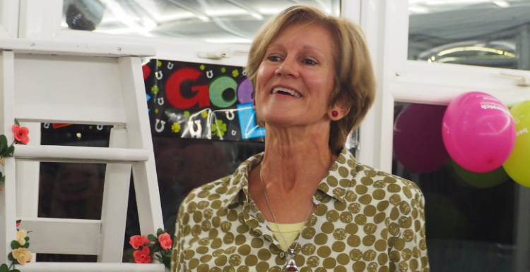 woman smiling at farewell party