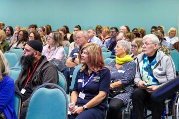 Audience listening to a presentation at Healthwatch Summit in October 2023