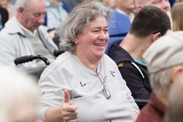 woman in wheelchair smiling 