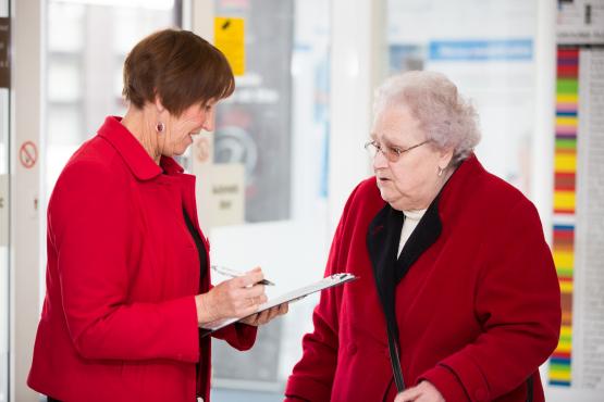 Healthwatch volunteer listens to member of the public